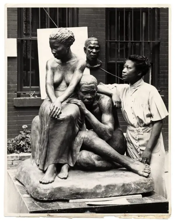 Augusta Savage posing with her sculpture Realization, created as part of the Works Progress Administration's Federal Art Project.