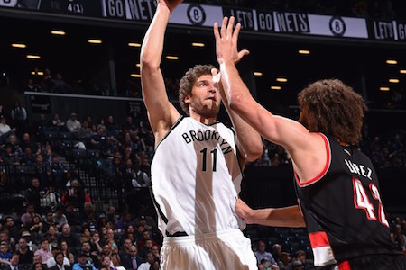 Brook Lopez shoots a jumper against his brother Robin Lopez. Jesse D. Garrabrant