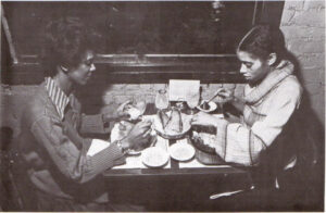 Cockeyed Clams — A couple seated eating.