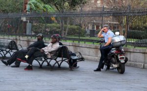 Transgenerational Trauma and Healing for African-Americans police officer watching 3 black men