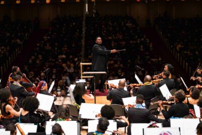 Musicians in the 2022 Gateways Music Festival Orchestra Concert perform with conductor Anthony Parnther in the orchestra’s Carnegie Hall debut.