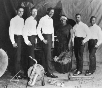 (Left to right, per Getty Image crediting): Ed Pollack, Albert Wynn, Thomas A. Dorsey, Ma Rainey, Dave Nelson, and Gabriel Washington in 1923